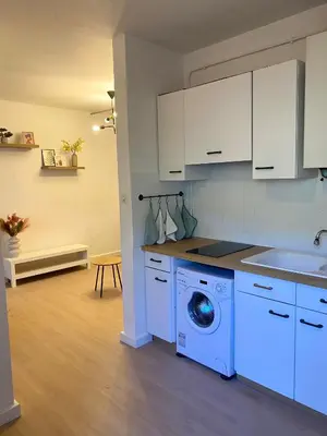a kitchen with a refrigerator and a microwave at Grand studio neuf, lumineux et au calme ! Tout équipé - Ajaccio in Ajaccio