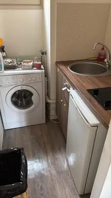 a kitchen with a washing machine and a sink at Ajaccio CATHEDRALE in Ajaccio