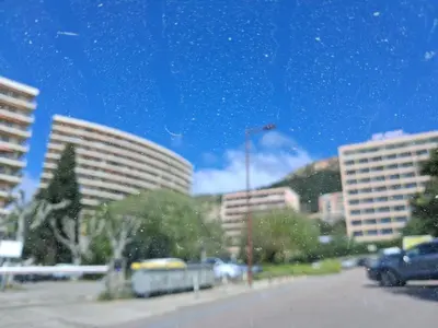 a view of a city with tall buildings and a street at Ajaccio VUE MER IMPRENABLE 4a5 Pers in Ajaccio