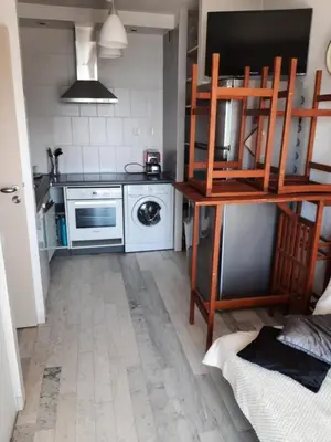 a small kitchen with a stove and a microwave at Ajaccio VUE MER IMPRENABLE 4a5 Pers in Ajaccio
