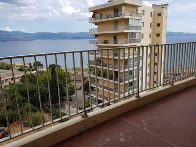 a balcony of a building with a view of the water at Ajaccio VUE MER IMPRENABLE 4a5 Pers in Ajaccio