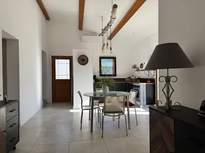 a kitchen and dining room with a table and chairs at Bergerie A Mandria di Rondinara in Bonifacio
