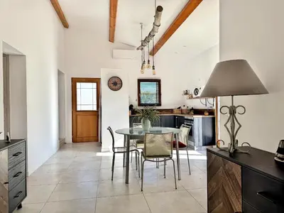 a kitchen and dining room with a table and chairs at Bergerie A Mandria di Rondinara in Bonifacio