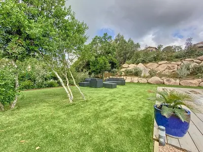 a lawn with a tree in a yard at Bergerie A Mandria di Rondinara in Bonifacio