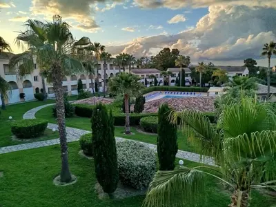 a view of the gardens of a resort at Appt 4-6 couchages climatisé avec 2 piscines et 200 m des plages et criques in Linguizzetta