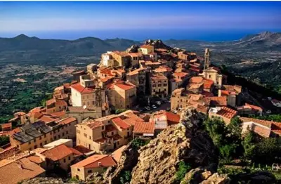 a village on top of a mountain at Appartement à Speloncato dans la plaine du Reginu 2, pour 3 personnes in Speloncato