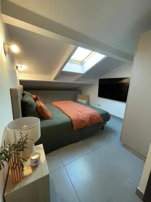 a bedroom with a bed and a flat screen tv at Apartment Propriano, Corsica in Propriano