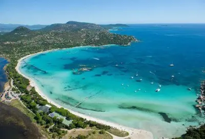 an aerial view of a beach with boats in the water at Maison proche Porto Vecchio in Porto-Vecchio
