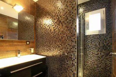 a bathroom with a shower and a sink and a mirror at NEPTUNE - Apartment 4 to 6 people - Port of Porto-Vecchio in Porto-Vecchio