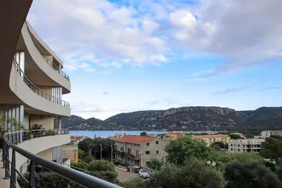 a view of the water from a balcony of a building at NEPTUNE - Apartment 4 to 6 people - Port of Porto-Vecchio in Porto-Vecchio