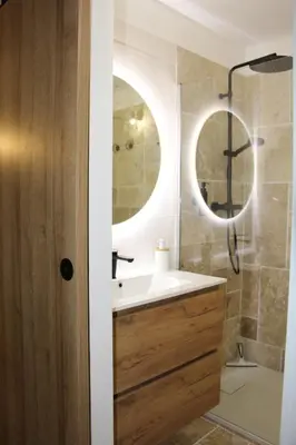 a bathroom with a sink and a mirror at Terra Corsa Duplex T2 in Porto Ota
