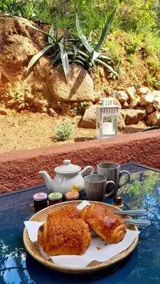a table with a plate of food on a table at Terra Corsa Duplex T2 in Porto Ota