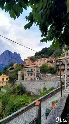 a city with buildings and a mountain in the background at Terra Corsa Duplex T2 in Porto Ota