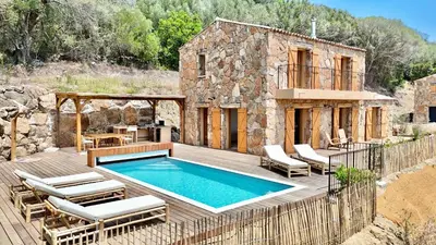 a villa with a swimming pool and a house at Bergerie de charme, piscine chauffée, vue nature entre mer et montagne, Sotta in Sotta