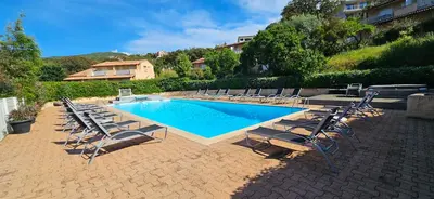 a group of chairs and a swimming pool at T2 Résidence Dolce & Vita B3 avec piscine in Propriano