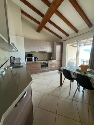 a balcony with a view of a swimming pool at Appartement dans résidence standing in Porto-Vecchio