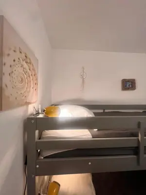 a bunk bed in a small room with aigiligiligil at Appartement A Maghjina proche port et centre ville in Porto-Vecchio