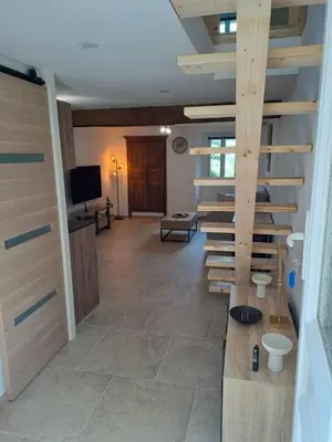 a hallway with a staircase in a house at Maison avec spa aux portes d'Ajaccio in Carbuccia