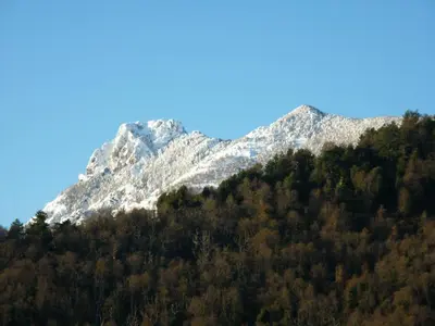 a mountain with snow capped mountains in the background at Casa Valentini in Quercitello