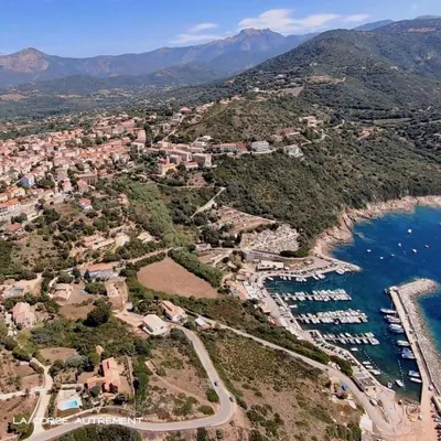 an aerial view of a town next to a body of water at Appartement vue mer Vulpaghja 01 in Cargèse