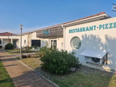 a restaurant sign on the side of a building at Casa Giul' Poggio Mezzana in Poggio-Mezzana