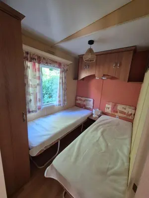 a small room with two beds and a window at Casa à leccia in Rapale