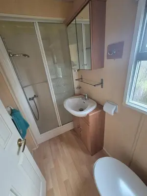 a bathroom with a sink and a shower and a toilet at Casa à leccia in Rapale