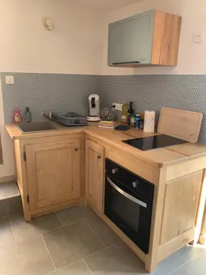 a kitchen with a sink and a stove top oven at Bella Vista in SantʼAntonino