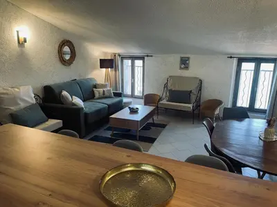 a living room with a couch and a table at Puntabe in Lama