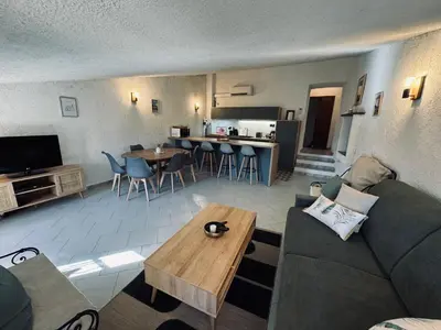 a living room with a couch and a table at Puntabe in Lama