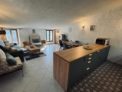 a living room with a couch and a table at Puntabe in Lama