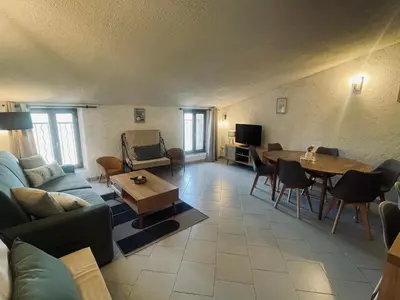 a living room with a couch and a table at Puntabe in Lama
