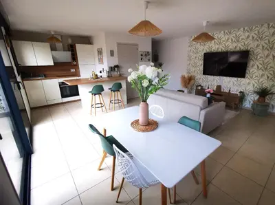 a living room with a couch and a table at Appartement T2 à Porto-Vecchio in Porto-Vecchio