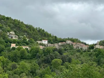 a group of houses on top of a hill at Appartement convivial à Marignana, proche de la nature in Marignana