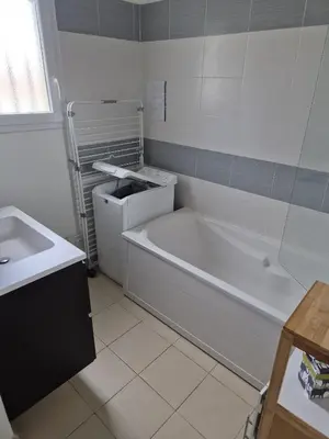 a white bathroom with a tub and a sink at hjpp in Poggio-Mezzana