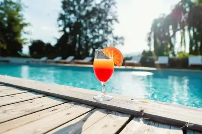 a group of chairs sitting next to a swimming pool at Camping - ccbbgaf in Ghisonaccia
