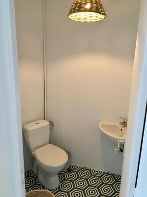 a bathroom with a toilet and a sink at Superb sea view villa with pool and big garden in Pietrosella