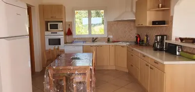 a kitchen with a counter with plastic wrap on it at Villa PIETRAROSSA in Lecci