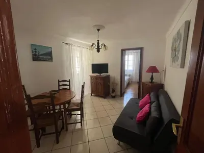 a living room with a couch and a table at Traversa in Vezzani