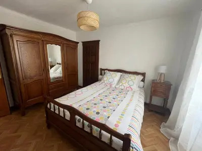 a bedroom with a bed and a dresser and a mirror at Traversa in Vezzani