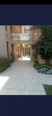 an empty courtyard of a building with a balcony at appartement bords de Mer in Santa-Lucia-di-Moriani