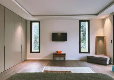 a living room with a flat screen tv on the wall at Villa Anjo in Zonza