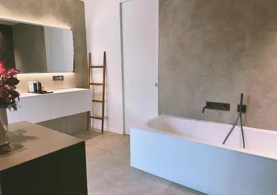 a bathroom with a white tub and a sink at Villa Anjo in Zonza