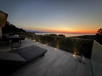 a deck with lights on the roof of a building at Casa Tre Fari in Bocca del Oro