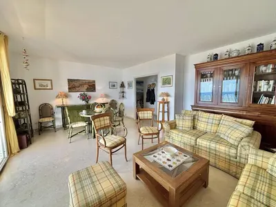 a living room with a couch and a table at Appartement Le Panoria sanguinaires Ajaccio in Ajaccio