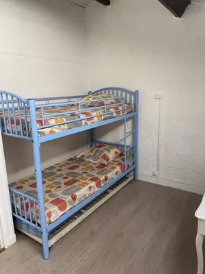 a room with two bunk beds in a room at closerie in Grosseto-Prugna