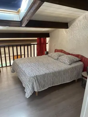 a bedroom with a bed in a room at closerie in Grosseto-Prugna