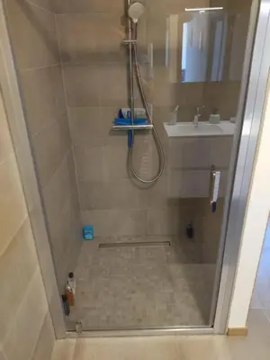 two beds sitting next to each other in a room at Porticcio - appartement T3 in Albitreccia
