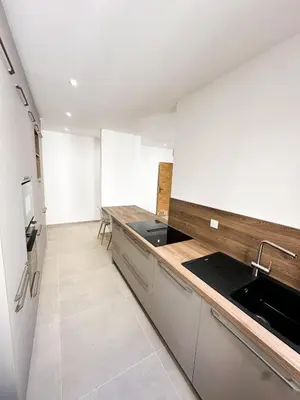 a kitchen with a sink and a counter top at Charmant T3 au coeur d'Ajaccio in Ajaccio