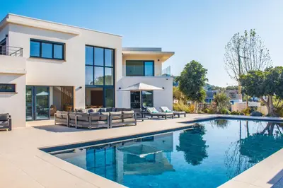 a house with a swimming pool in front of it at Villa Alimea San Ciprianu in Cirendinu